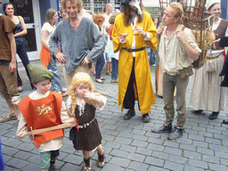 People in medieval clothes at the Houtstraat street, during the Gebroeders van Limburg Festival