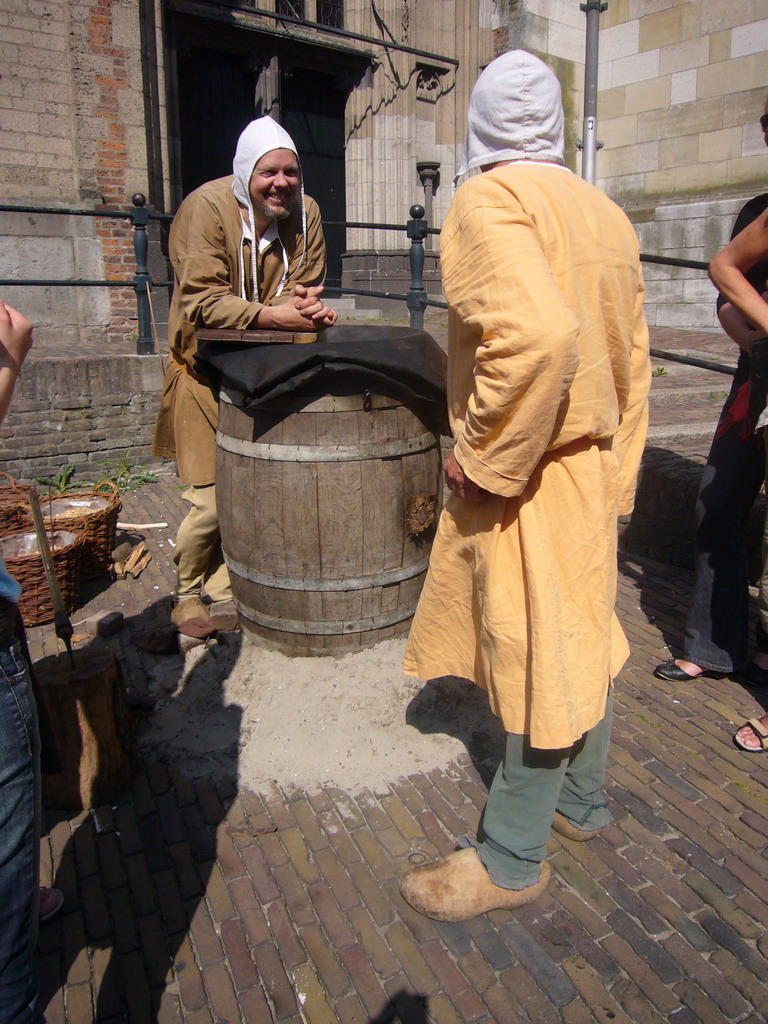 People in medieval clothes in front of the Sint Stevenskerk church at the Sint Stevenskerkhof square, during the Gebroeders van Limburg Festival