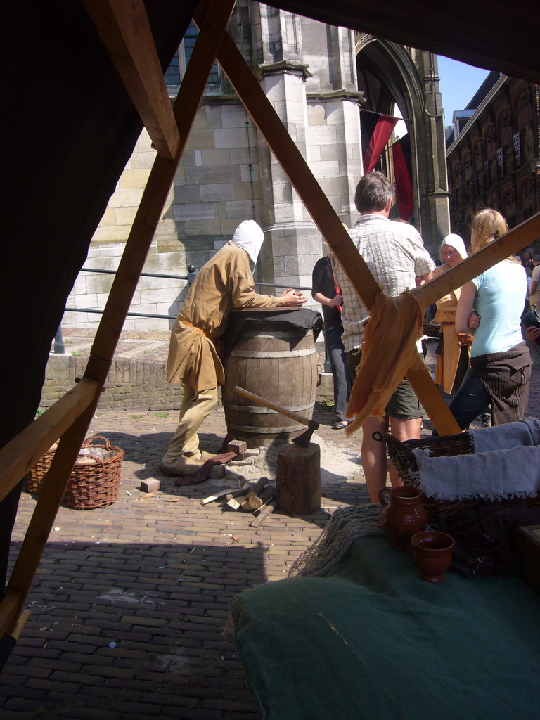 People in medieval clothes in front of the Sint Stevenskerk church at the Sint Stevenskerkhof square, during the Gebroeders van Limburg Festival