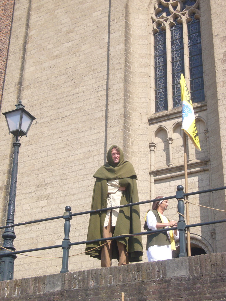 People in medieval clothes in front of the Sint Stevenskerk church at the Sint Stevenskerkhof square, during the Gebroeders van Limburg Festival