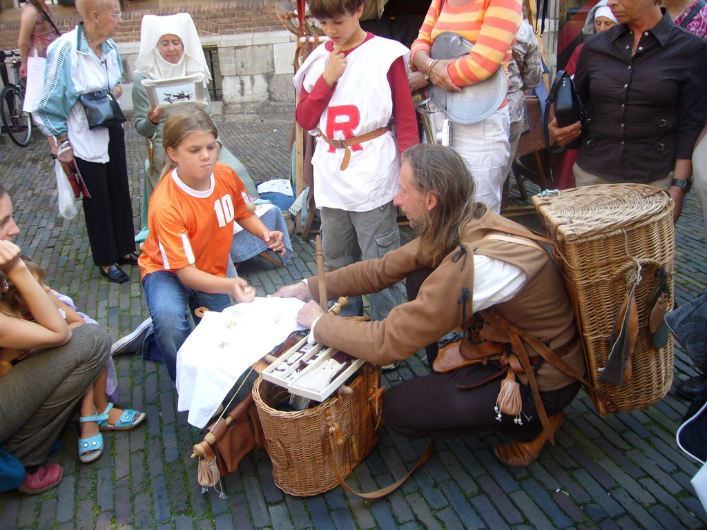 People in medieval clothes at the Sint Stevenskerkhof square, during the Gebroeders van Limburg Festival