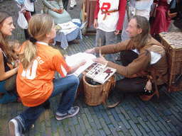 People in medieval clothes at the Sint Stevenskerkhof square, during the Gebroeders van Limburg Festival