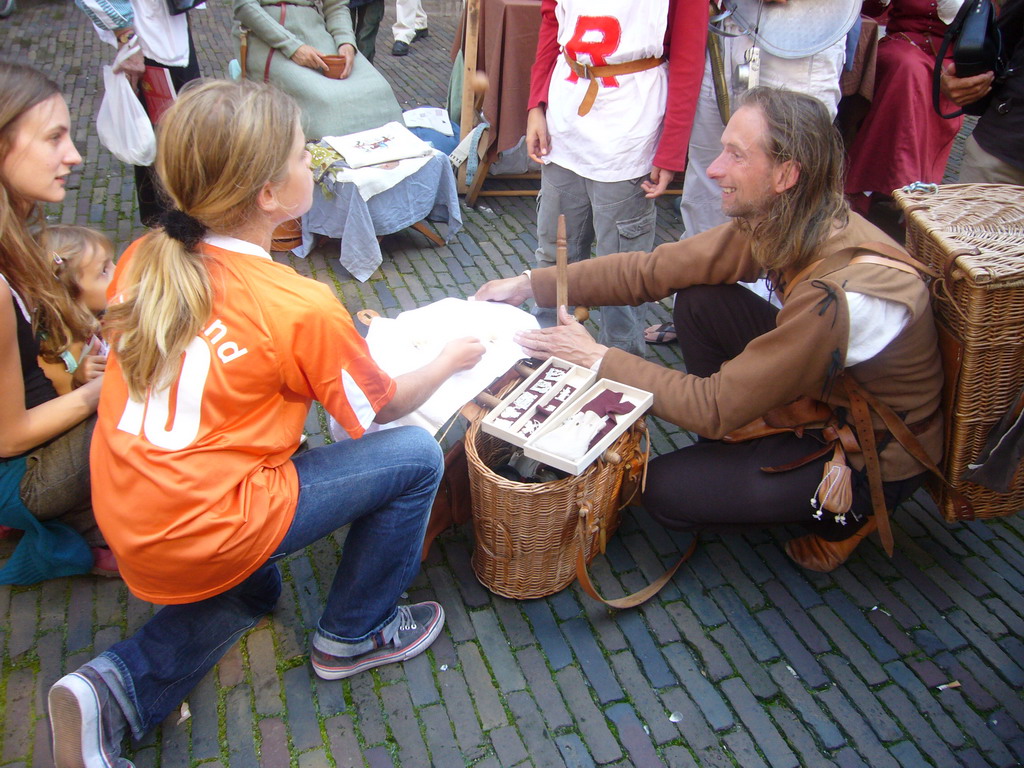 People in medieval clothes at the Sint Stevenskerkhof square, during the Gebroeders van Limburg Festival