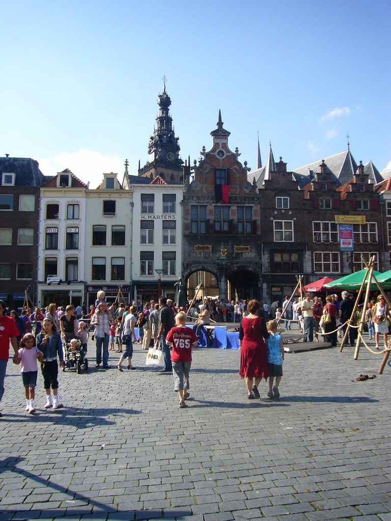 The west side of the Grote Markt square, the Kerkboog arch and the tower of the Sint Stevenskerk church, during the Gebroeders van Limburg Festival