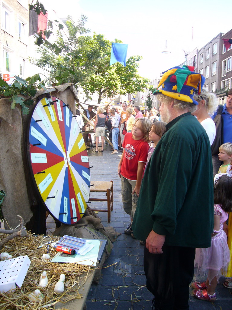 People playing the wheel of fortune at the Broerstraat street, during the Gebroeders van Limburg Festival