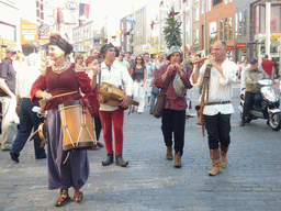 People dressed as medieval musicians at the Broerstraat street, during the Gebroeders van Limburg Festival