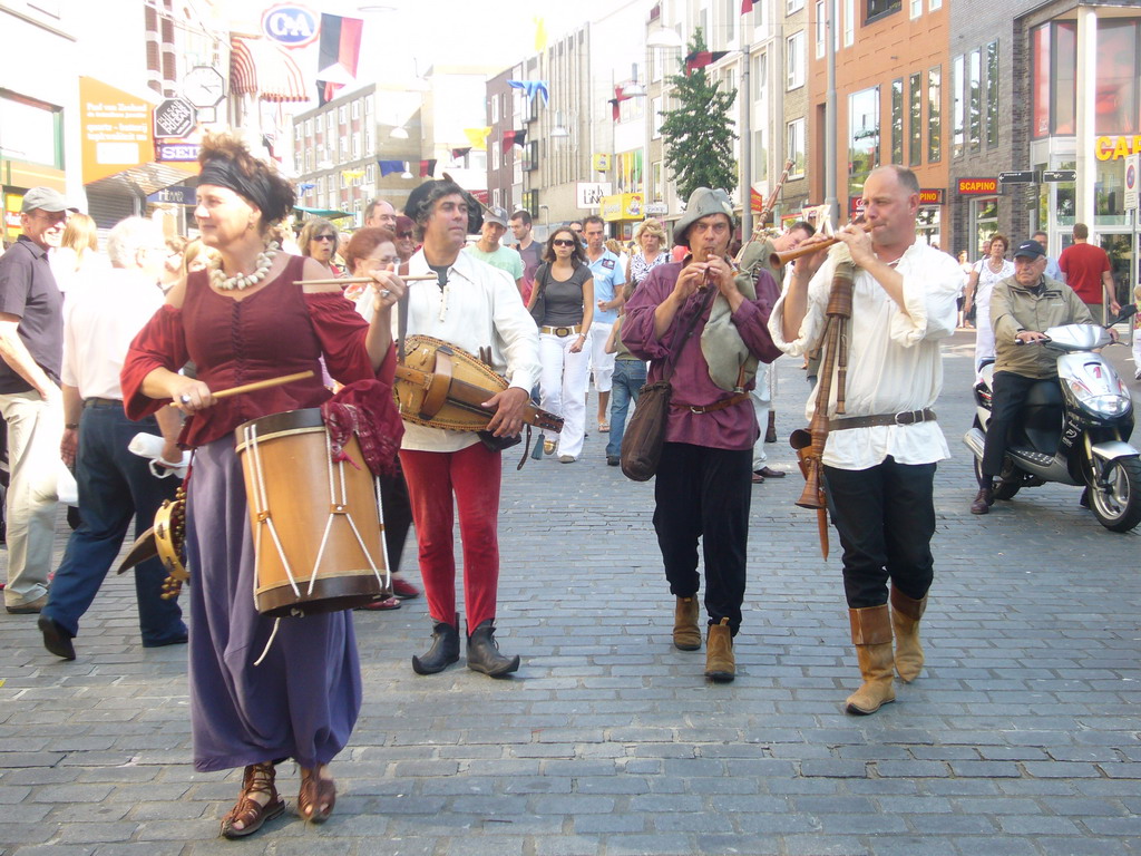 People dressed as medieval musicians at the Broerstraat street, during the Gebroeders van Limburg Festival