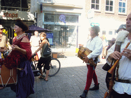 People dressed as medieval musicians at the Broerstraat street, during the Gebroeders van Limburg Festival