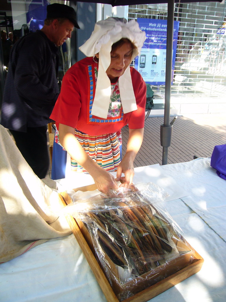 People in medieval clothes selling eel at the Broerstraat street, during the Gebroeders van Limburg Festival