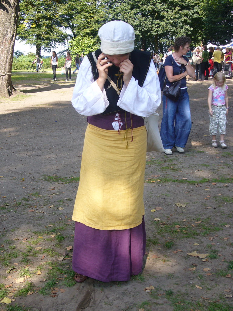 Person in medieval clothes at the Valkhof park, during the Gebroeders van Limburg Festival