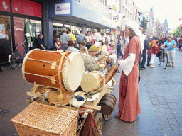 People in medieval clothes with musical instruments at the Broerstraat street, during the Gebroeders van Limburg Festival