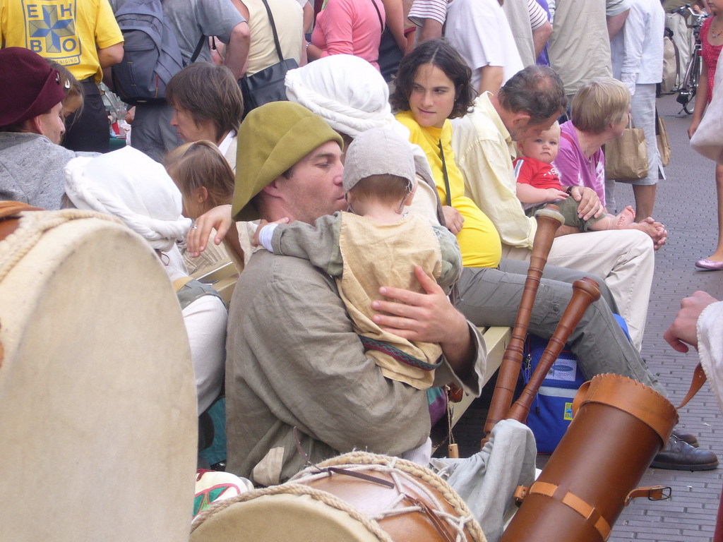 People in medieval clothes with musical instruments at the Broerstraat street, during the Gebroeders van Limburg Festival