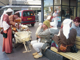 People in medieval clothes with musical instruments at the Broerstraat street, during the Gebroeders van Limburg Festival