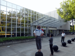 Miaomiao and her parents in front of the Aula building of the Radboud University Nijmegen at the Comeniuslaan street