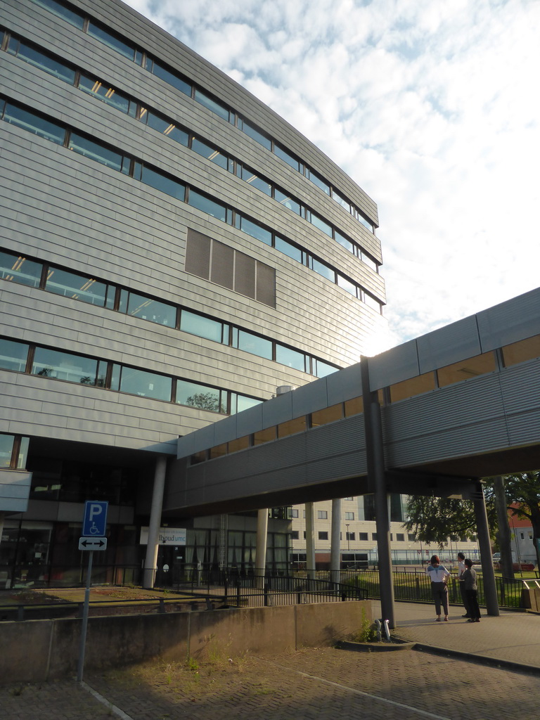 Miaomiao and her parents in front of the NCMLS building of the University Medical Center St. Radboud at the Comeniuslaan street