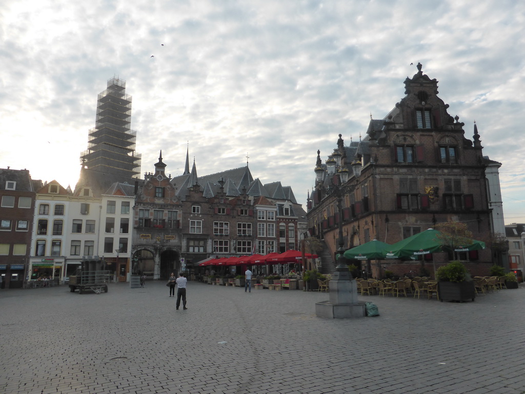 Miaomiao`s parents at the Grote Markt square with the Sint-Stevenskerk church, under renovation, and the Waag building