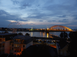 The Waalbrug bridge over the Waal river and a ferris wheel, viewed from the northwest side of the Valkhof park