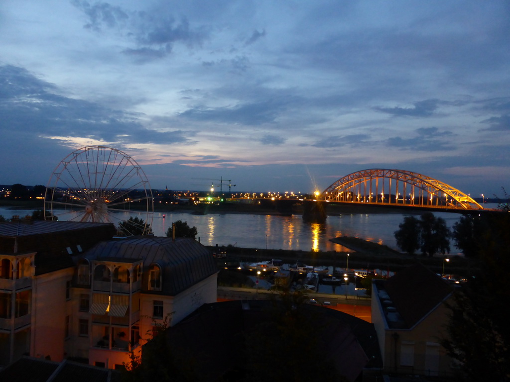 The Waalbrug bridge over the Waal river and a ferris wheel, viewed from the northwest side of the Valkhof park