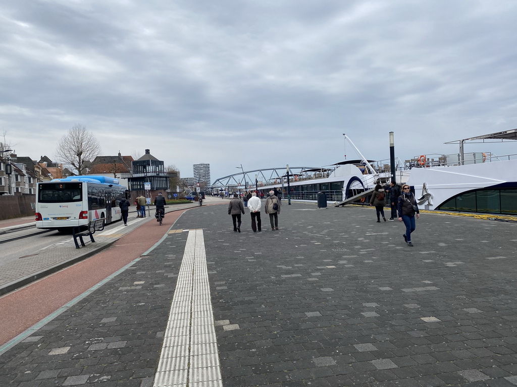 Boat on the Waal river, the Waalkade street and the Nijmegen railway bridge