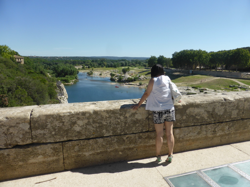 Miaomiao at the Pont du Gard aqueduct bridge, with a view on the north side of the Gardon river