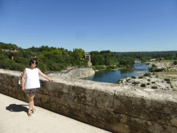 Miaomiao at the Pont du Gard aqueduct bridge, with a view on the north side of the Gardon river