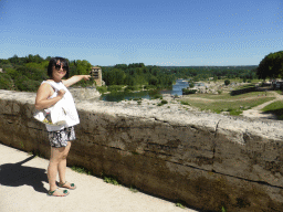 Miaomiao at the Pont du Gard aqueduct bridge, with a view on the north side of the Gardon river