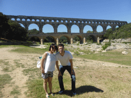 Tim and Miaomiao with the Pont du Gard aqueduct bridge and the grassland at the northeast side