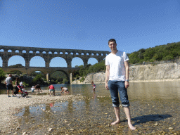 Tim at the north side of the Gardon river, with a view on the Pont du Gard aqueduct bridge