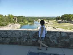 Miaomiao at the Pont du Gard aqueduct bridge, with a view on the north side of the Gardon river
