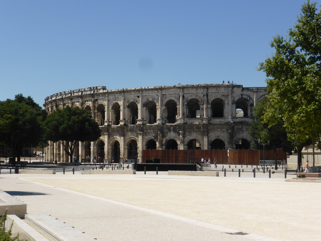 The Esplanade Charles-de-Gaulle square, and the east side of the Arena of Nîmes at the Place des Arènes square