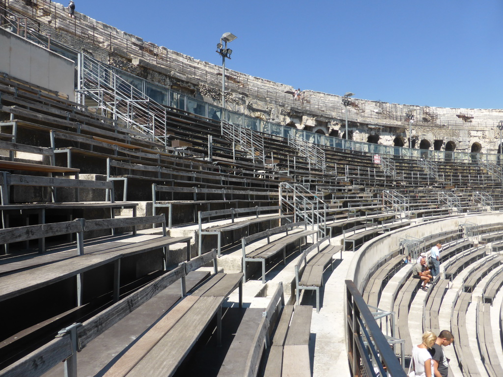 The lower middle rows of seats at the west side of the Arena of Nîmes