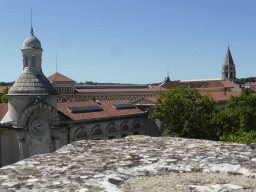 The Lycée Alphonse Daudet building and the tower of the Église Saint-Paul de Nîmes church, viewed from the top rows of seats of the Arena of Nîmes