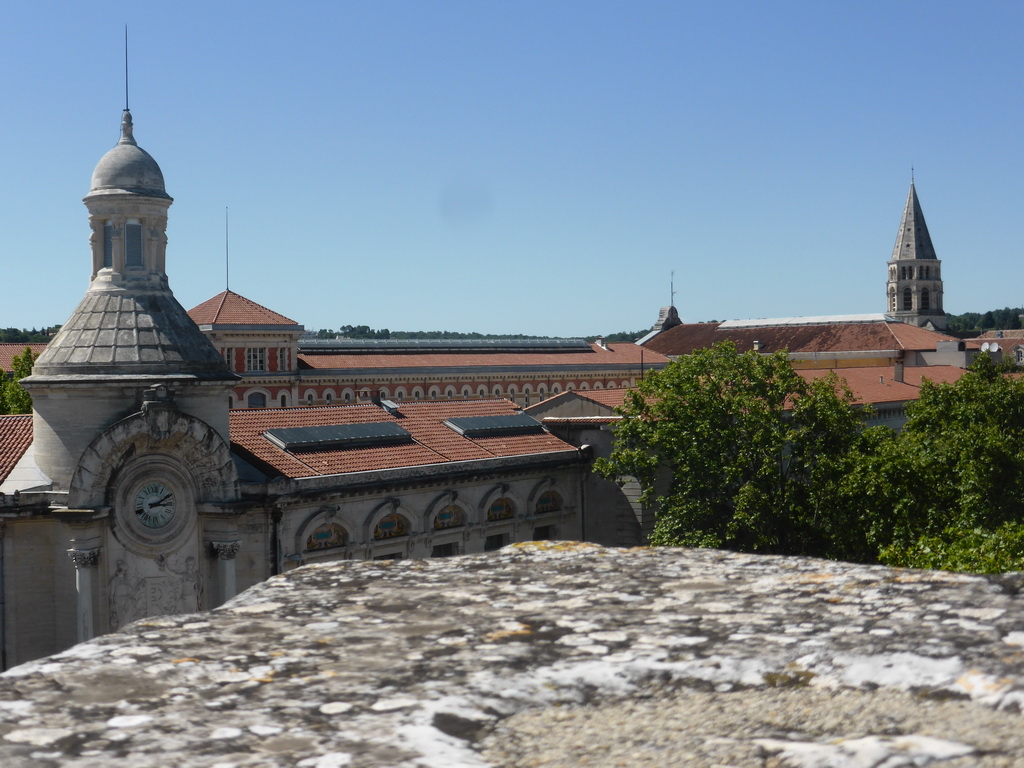 The Lycée Alphonse Daudet building and the tower of the Église Saint-Paul de Nîmes church, viewed from the top rows of seats of the Arena of Nîmes