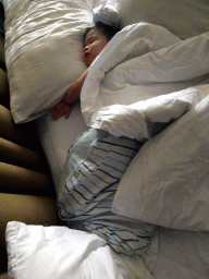 Max sleeping in our room at the Inaya Putri Bali hotel