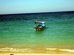 Boat in the Lombok Strait, viewed from the beach of the Inaya Putri Bali hotel