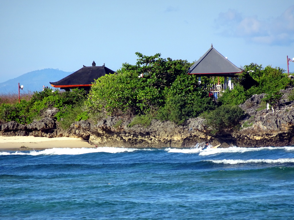 The Pura Bias Tugel temple at Peninsula Island and the Lombok Strait, viewed from the beach of the Inaya Putri Bali hotel