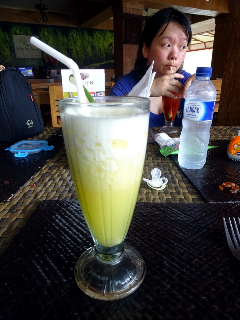 Miaomiao drinking a cocktail at the Bebek Tepi Sawah restaurant at the Bali Collection shopping mall