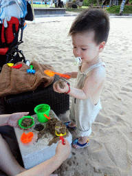 Max playing with sand at the beach of the Inaya Putri Bali hotel