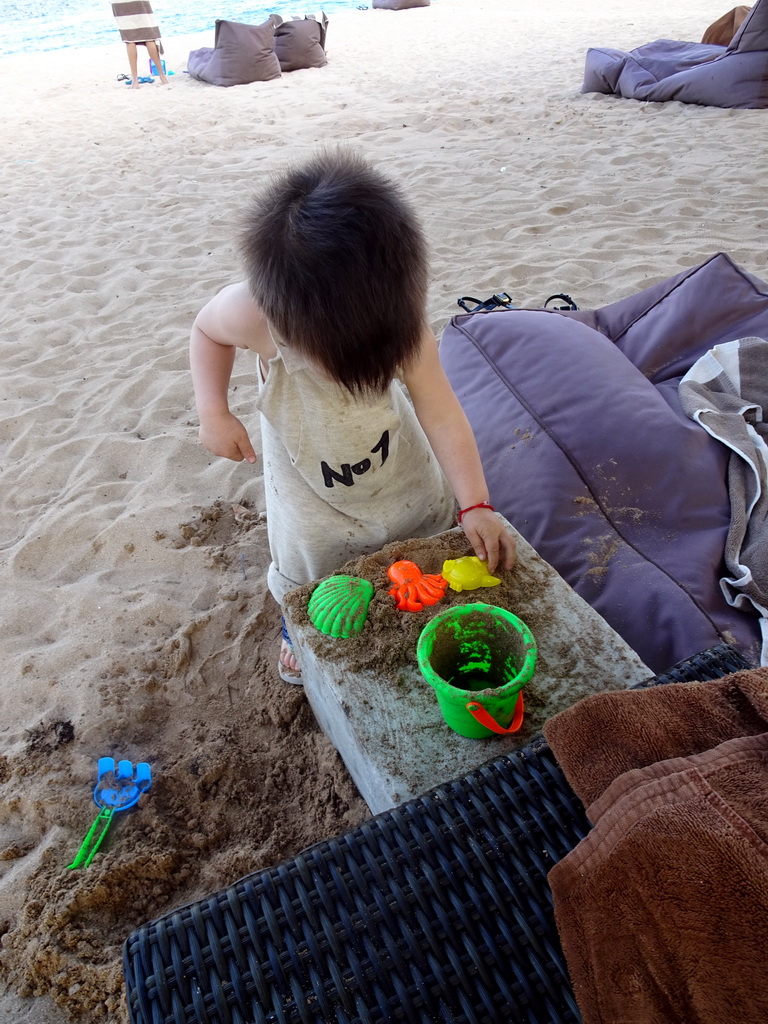 Max playing with sand at the beach of the Inaya Putri Bali hotel