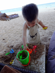 Max playing with sand at the beach of the Inaya Putri Bali hotel