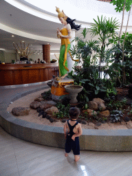 Max with a statue at the Ja`Jan Bistro restaurant at the Inaya Putri Bali hotel