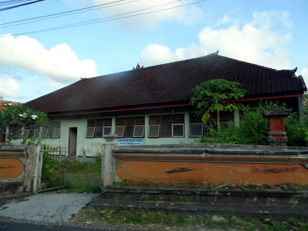 Front of a building at the Jalan Dharmawangsa street, viewed from the taxi from Uluwatu
