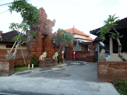 Entrance gate to a temple at the Jalan Dharmawangsa street, viewed from the taxi from Uluwatu