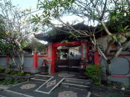 Entrance gate to a temple at the Jalan Dharmawangsa street, viewed from the taxi from Uluwatu