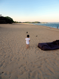 Max with birds at the beach of the Inaya Putri Bali hotel