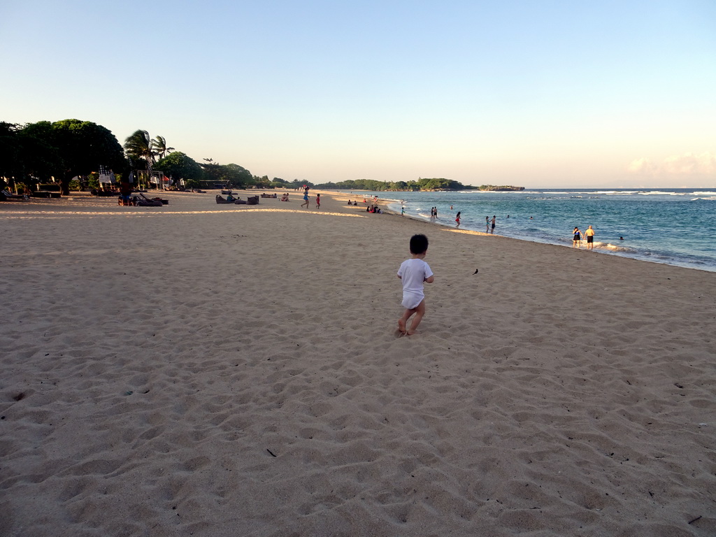 Max with birds at the beach of the Inaya Putri Bali hotel