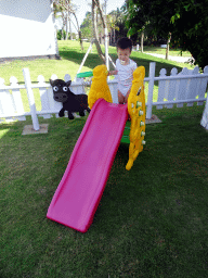 Max on the slide at the `Kids Land` playground at the Inaya Putri Bali hotel