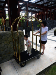 Miaomiao and Max on a luggage kart at the Inaya Putri Bali hotel