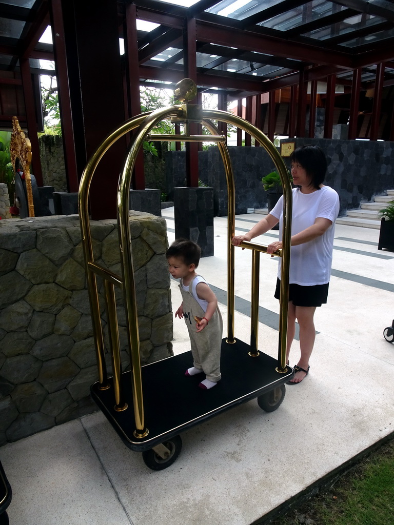 Miaomiao and Max on a luggage kart at the Inaya Putri Bali hotel