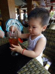 Max drinking an ice tea at the Bebek Tepi Sawah restaurant at the Bali Collection shopping mall